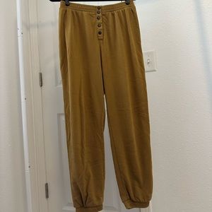 Brown joggers with black button detailing
